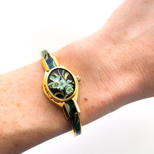 Load image into Gallery viewer, Vintage André Mouche Quartz Watch with Black & Green Enamel Floral Design, Concealed Dial and Gold-Plated Bangle Bracelet - Boxed