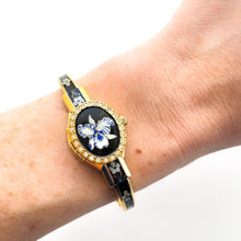 Load image into Gallery viewer, Vintage André Mouche Quartz Watch with Black & Blue Enamel Floral Design, Crystal-Set Bezel, Concealed Dial and Gold-Plated Bracelet - Boxed