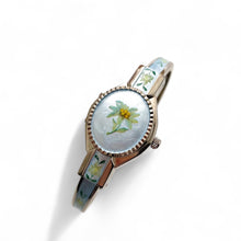Load image into Gallery viewer, Vintage 1990s André Mouche Quartz Watch with Light Blue Enamel Floral Design, Concealed Dial and Silver-Tone Bangle Bracelet