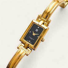 Load image into Gallery viewer, Givenchy Millésime – Gold-Plated Quartz Bangle Watch with Black Dial, 1990s