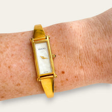 Load image into Gallery viewer, Vintage Gucci 1500L Gold Bangle Watch with Mother of Pearl Dial, 90s Quartz