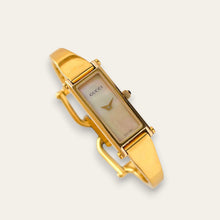 Load image into Gallery viewer, Vintage Gucci 1500L Gold Bangle Watch with Mother of Pearl Dial, 90s Quartz