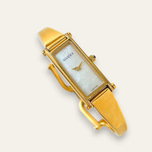 Load image into Gallery viewer, Vintage Gucci 1500L Gold Bangle Watch with Mother of Pearl Dial, 90s Quartz