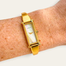 Load image into Gallery viewer, Vintage Gucci 1500 Gold Bangle Watch with Mother of Pearl Dial, 90s Quartz