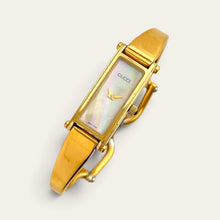 Load image into Gallery viewer, Vintage Gucci 1500 Gold Bangle Watch with Mother of Pearl Dial, 90s Quartz