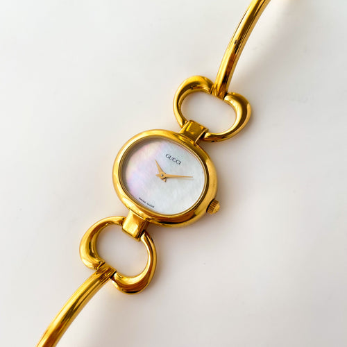 1990s Gucci Quartz Watch with Mother of Pearl Dial and Semi Bangle Bracelet