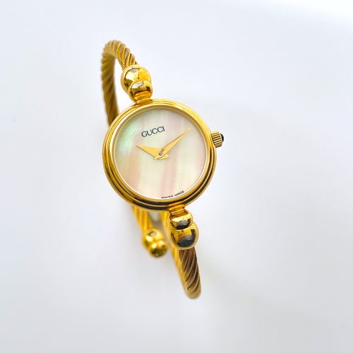Vintage Ladies' Gold-Tone Gucci Bangle Quartz Watch with Mother of Pearl Dial