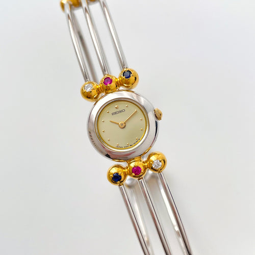 Very Rare 1990s Two-Tone Seiko Articulated Bangle Quartz Watch with Three Coloured Gemstones