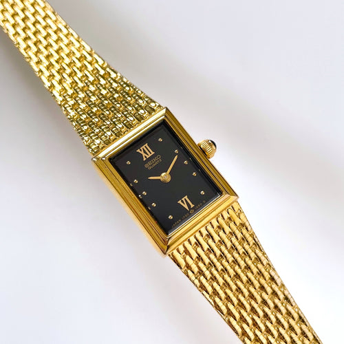 1990s Ladies' Gold-Plated Seiko Quartz Watch with Black Rectangular Dial