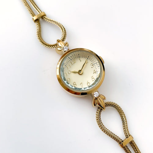Elegant Gold-Plated Ladies' Quartz Watch with Small Round Dial and Dainty Bracelet