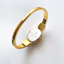 Load image into Gallery viewer, Vintage Andr√© Mouche Quartz Watch with Enamel Floral Design, Concealead Dial and Gold-Plated Bangle Bracelet
