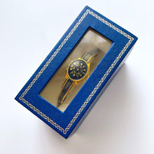 Load image into Gallery viewer, Vintage Andr√© Mouche Quartz Watch with Gold and Navy Enamel Floral Design, Concealead Dial and Gold-Plated Bangle Bracelet
