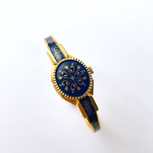 Load image into Gallery viewer, Vintage Andr√© Mouche Quartz Watch with Gold and Navy Enamel Floral Design, Concealead Dial and Gold-Plated Bangle Bracelet
