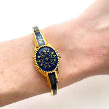 Load image into Gallery viewer, Vintage Andr√© Mouche Quartz Watch with Gold and Navy Enamel Floral Design, Concealead Dial and Gold-Plated Bangle Bracelet
