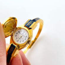Load image into Gallery viewer, Vintage Andr√© Mouche Quartz Watch with Gold and Navy Enamel Floral Design, Concealead Dial and Gold-Plated Bangle Bracelet
