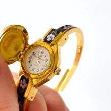 Load image into Gallery viewer, Vintage André Mouche Quartz Watch with Black and Purple Enamel Floral Design, Concealead Dial and Gold-Plated Bangle Bracelet
