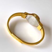 Load image into Gallery viewer, Vintage Andr√© Mouche Quartz Watch with Black Enamel Floral Design, Concealead Dial and Gold-Plated Bangle Bracelet
