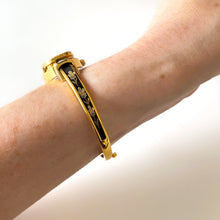Load image into Gallery viewer, Vintage Andr√© Mouche Quartz Watch with Black Enamel Floral Design, Concealead Dial and Gold-Plated Bangle Bracelet
