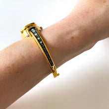 Load image into Gallery viewer, Vintage Andr√© Mouche Quartz Watch with Black and Green Enamel Floral Design, Concealead Dial and Gold-Plated Bangle Bracelet
