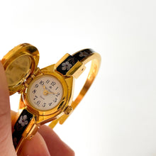 Load image into Gallery viewer, Vintage Andr√© Mouche Quartz Watch with Black and Purple Enamel Floral Design, Concealead Dial and Gold-Plated Bangle Bracelet
