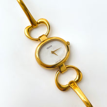 Load image into Gallery viewer, 1990s Gucci Quartz Watch with Mother of Pearl Dial and Semi Bangle Bracelet
