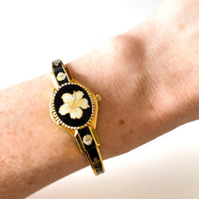 Load image into Gallery viewer, Vintage Andr√© Mouche Quartz Watch with Black Enamel Floral Design, Concealead Dial and Gold-Plated Bangle Bracelet
