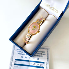 Load image into Gallery viewer, Vintage Andr√© Mouche Quartz Watch with Pink Enamel Floral Design, Concealead Dial and Gold-Plated Bangle Bracelet
