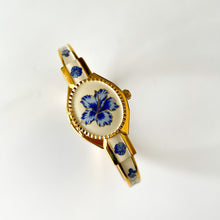Load image into Gallery viewer, Vintage Andr√© Mouche Quartz Watch with Beige and Blue Enamel Floral Design, Concealead Dial and Gold-Plated Bangle Bracelet
