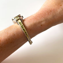 Load image into Gallery viewer, Vintage Andr√© Mouche Quartz Watch with Pink Enamel Floral Design, Concealead Dial and Silver Tone Bangle Bracelet
