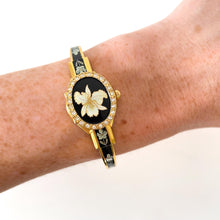 Load image into Gallery viewer, Vintage Andr√© Mouche Quartz Watch with Black Enamel Floral Design, Concealead Dial and Gold-Plated Bangle Bracelet
