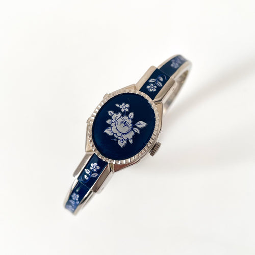 Vintage Andr√© Mouche Quartz Watch with Navy Enamel Floral Design, Concealead Dial and Silver-Tone Bangle Bracelet