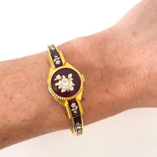 Load image into Gallery viewer, Vintage Andr√© Mouche Quartz Watch with Burgundy Enamel Floral Design, Concealead Dial and Gold-Plated Bangle Bracelet
