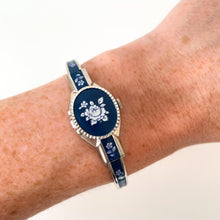 Load image into Gallery viewer, Vintage Andr√© Mouche Quartz Watch with Navy Enamel Floral Design, Concealead Dial and Silver-Tone Bangle Bracelet
