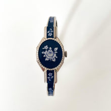 Load image into Gallery viewer, Vintage Andr√© Mouche Quartz Watch with Navy Enamel Floral Design, Concealead Dial and Silver-Tone Bangle Bracelet
