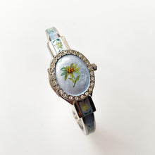 Load image into Gallery viewer, Vintage Andr√© Mouche Quartz Watch with Light Blue Enamel Floral Design, Concealed Dial and Silver-Tone Bangle Bracelet
