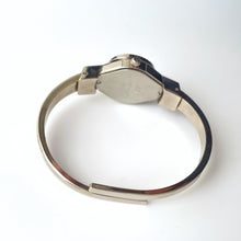 Load image into Gallery viewer, Vintage Andr√© Mouche Quartz Watch with Enamel Floral Design, Concealed Dial and Silver-Tone Bangle Bracelet
