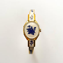 Load image into Gallery viewer, Vintage Andr√© Mouche Quartz Watch with Beige and Blue Enamel Floral Design, Concealed Dial and Gold-Plated Bangle Bracelet
