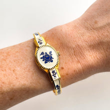 Load image into Gallery viewer, Vintage Andr√© Mouche Quartz Watch with Beige and Blue Enamel Floral Design, Concealed Dial and Gold-Plated Bangle Bracelet

