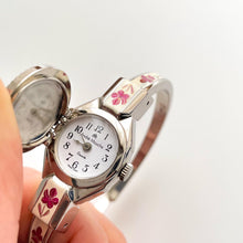 Load image into Gallery viewer, Vintage 1999 Andr√© Mouche Quartz Watch with Pink Enamel Floral Design, Concealed Dial and Silver-Tone Bangle Bracelet
