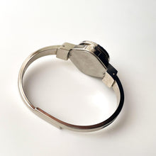 Load image into Gallery viewer, Vintage Andr√© Mouche Quartz Watch with Navy Enamel Floral Design, Concealed Dial and Silver-Tone Bangle Bracelet
