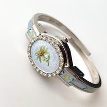 Load image into Gallery viewer, Vintage Andr√© Mouche Quartz Watch with Light Blue Enamel Floral Design, Concealed Dial and Silver-Tone Bangle Bracelet
