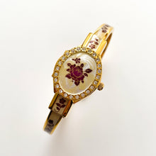 Load image into Gallery viewer, Vintage Andr√© Mouche Quartz Watch with Enamel Floral Design, Concealed Dial and Gold-Plated Bangle Bracelet
