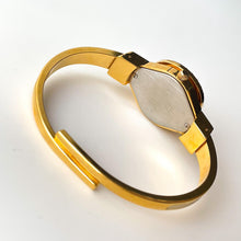 Load image into Gallery viewer, Vintage Andr√© Mouche Quartz Watch with Enamel Floral Design, Concealed Dial and Gold-Plated Bangle Bracelet
