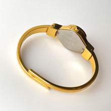 Load image into Gallery viewer, Vintage Andr√© Mouche Quartz Watch with Pink Enamel Floral Design, Concealed Dial and Gold-Plated Bangle Bracelet
