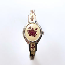 Load image into Gallery viewer, Vintage Andr√© Mouche Quartz Watch with Burgundy Enamel Floral Design, Concealed Dial and Silver-Tone Bangle Bracelet

