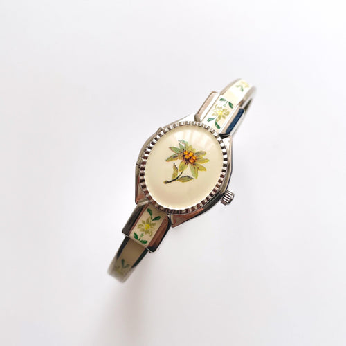 Vintage Andr√© Mouche Quartz Watch with Enamel Floral Design, Concealed Dial and Silver-Tone Bangle Bracelet