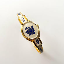 Load image into Gallery viewer, Vintage Andr√© Mouche Quartz Watch with Beige and Blue Enamel Floral Design, Concealed Dial and Gold-Plated Bangle Bracelet
