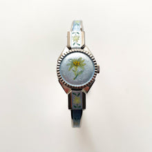 Load image into Gallery viewer, Vintage 1998 Andr√© Mouche Quartz Watch with Light Blue Enamel Floral Design, Concealed Dial and Silver-Tone Bangle Bracelet
