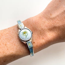 Load image into Gallery viewer, Vintage 1998 Andr√© Mouche Quartz Watch with Light Blue Enamel Floral Design, Concealed Dial and Silver-Tone Bangle Bracelet
