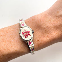 Load image into Gallery viewer, Vintage 1999 Andr√© Mouche Quartz Watch with Pink Enamel Floral Design, Concealed Dial and Silver-Tone Bangle Bracelet
